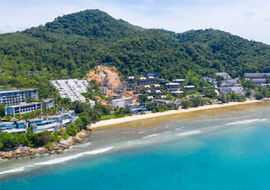 Beachfront villas nestled amidst lush mountains at Kamala Beach