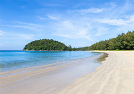 Panoramic view of Layan Beach with sandy shores and clear blue waters