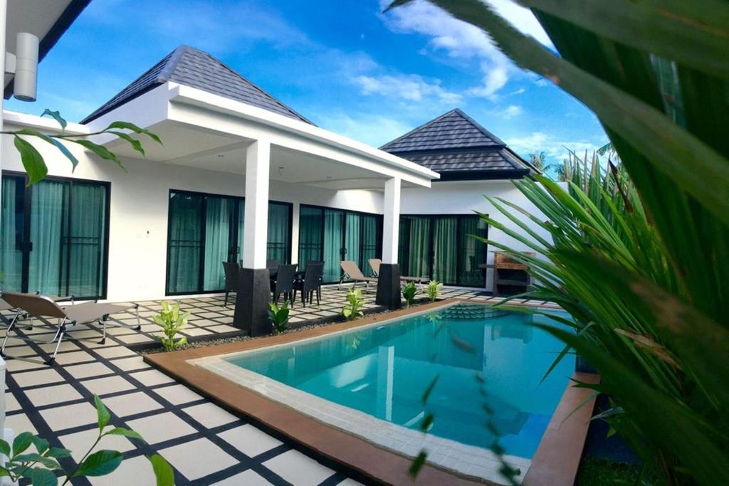 Exterior view of a private pool at Clos Vougeot Villa in Rawai Beach