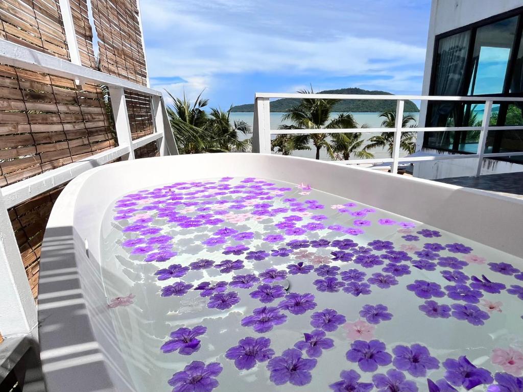 Hot tub with flowers at Ocean Villas in Rawai Beach