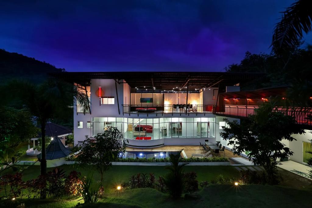 Exterior night view of a private pool at Nap Dau in Chalong