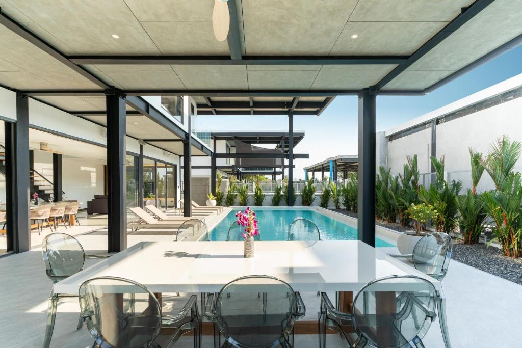 Dining table with private pool villa at Sunset Garden in Phuket