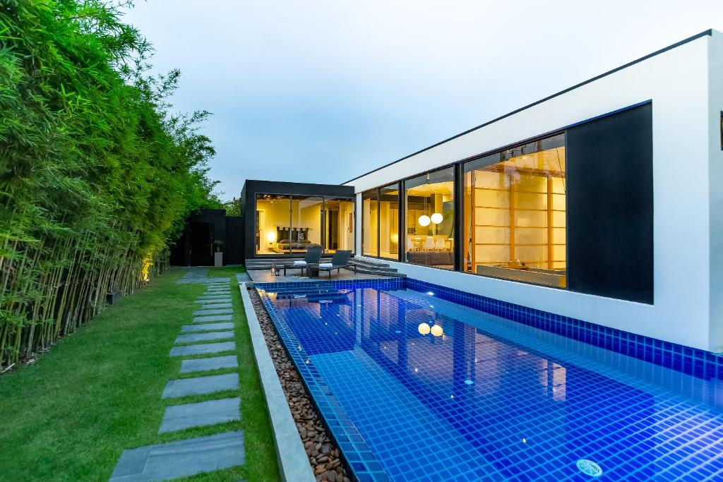 Exterior view of a private pool at Villa Kuso in Layan Beach